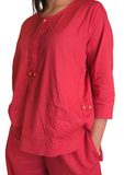Model wearing red two-piece co-ord set, relaxed top women’s ethnic fusion wear- Indu Heritage.Soft, breathable fabric for all-day comfort.Relaxed fit for all-day wear.Side pockets for added functionality.Lightweight, breathable cotton fabric ideal for all seasons.Soft, breathable fabric for all-day comfort.Relaxed fit for all-day wear.Side pockets for added functionality.Lightweight, breathable cotton fabric ideal for all seasons.Elegant,Relaxed-fit top with subtle neckline detailing,Versatile outfit.