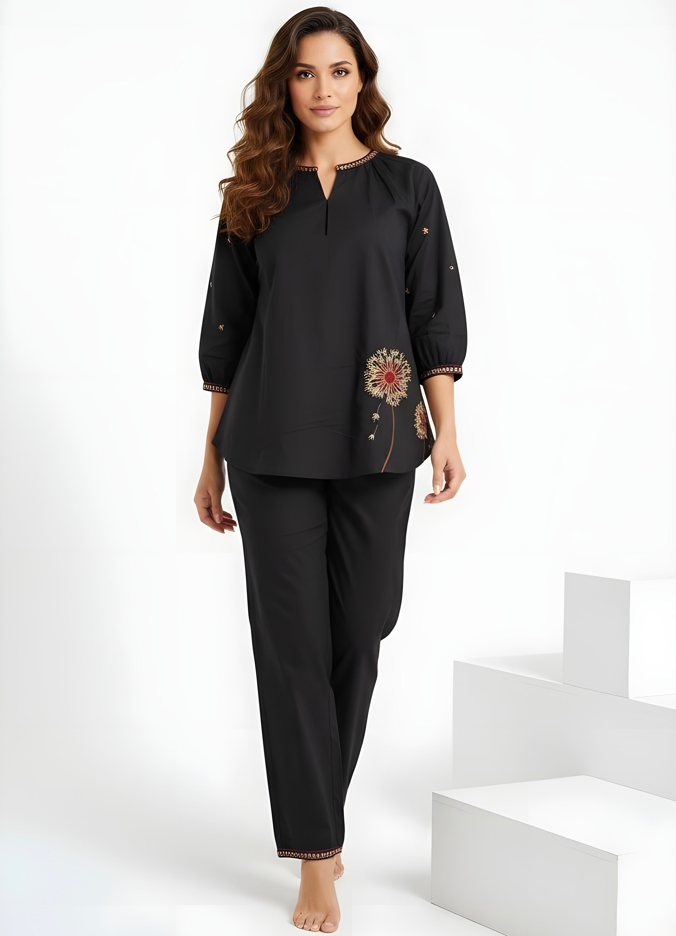Model wearing black two-piece co-ord set with floral embroidery and relaxed top women’s ethnic fusion wear- Indu Heritage.Soft, breathable fabric for all-day comfort.Relaxed fit for all-day wear.Side pockets for added functionality.Lightweight, breathable cotton fabric ideal for all seasons